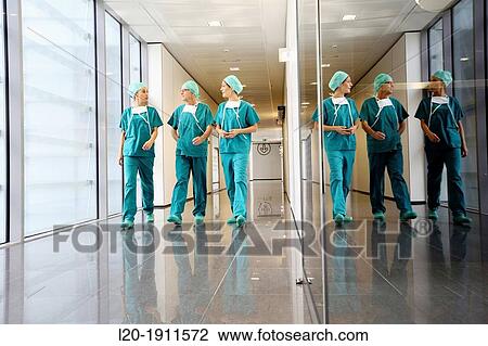 Stock Image - surgeons walking in the operating room hallway, Onkologikoa Hospital, Oncology Institute, Case Center for prevention, diagnosis and treatment of cancer, Donostia, San Sebastian, Gipuzkoa, Basque Country, Spain. Fotosearch