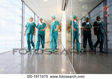 Stock Image - surgeons walking in the operating room hallway, Onkologikoa Hospital, Oncology Institute, Case Center for prevention, diagnosis and treatment of cancer, Donostia, San Sebastian, Gipuzkoa, Basque Country, Spain. Fotosearch