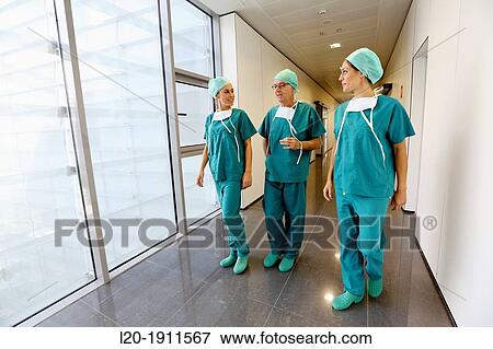 Stock Photo - surgeons walking in the operating room hallway, Onkologikoa Hospital, Oncology Institute, Case Center for prevention, diagnosis and treatment of cancer, Donostia, San Sebastian, Gipuzkoa, Basque Country, Spain. Fotosearch