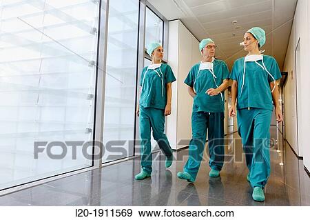 Stock Photo - surgeons walking in the operating room hallway, Onkologikoa Hospital, Oncology Institute, Case Center for prevention, diagnosis and treatment of cancer, Donostia, San Sebastian, Gipuzkoa, Basque Country, Spain. Fotosearch