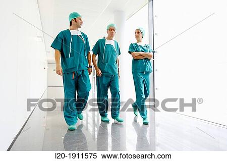 Stock Photography - surgeons walking in the operating room hallway, Onkologikoa Hospital, Oncology Institute, Case Center for prevention, diagnosis and treatment of cancer, Donostia, San Sebastian, Gipuzkoa, Basque Country, Spain. Fotosearch