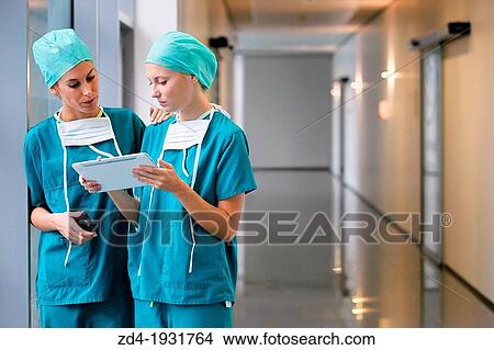 Surgeons with tablet in the operating room hallway, Onkologikoa Hospital, Oncology Institute, Case Center for prevention, diagnosis and treatment of cancer, Donostia, San Sebastian, Gipuzkoa, Basque Country, Spain View Large Photo Image Picture - Surgeons with tablet in the operating room hallway, Onkologikoa Hospital, Oncology Institute, Case Center for prevention, diagnosis and treatment of cancer, Donostia, San Sebastian, Gipuzkoa, Basque Country, Spain. Fotosearch