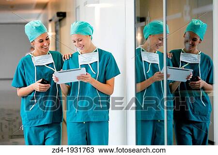 Surgeons with tablet in the operating room hallway, Onkologikoa Hospital, Oncology Institute, Case Center for prevention, diagnosis and treatment of cancer, Donostia, San Sebastian, Gipuzkoa, Basque Country, Spain View Large Photo Image Stock Image - Surgeons with tablet in the operating room hallway, Onkologikoa Hospital, Oncology Institute, Case Center for prevention, diagnosis and treatment of cancer, Donostia, San Sebastian, Gipuzkoa, Basque Country, Spain. Fotosearch