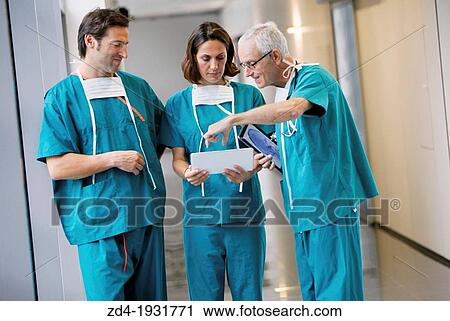 Surgeons with tablet in the operating room hallway, Onkologikoa Hospital, Oncology Institute, Case Center for prevention, diagnosis and treatment of cancer, Donostia, San Sebastian, Gipuzkoa, Basque Country, Spain View Large Photo Image Stock Image - Surgeons with tablet in the operating room hallway, Onkologikoa Hospital, Oncology Institute, Case Center for prevention, diagnosis and treatment of cancer, Donostia, San Sebastian, Gipuzkoa, Basque Country, Spain. Fotosearch