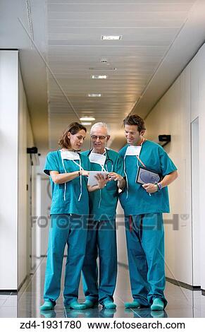 Surgeons with tablet in the operating room hallway, Onkologikoa Hospital, Oncology Institute, Case Center for prevention, diagnosis and treatment of cancer, Donostia, San Sebastian, Gipuzkoa, Basque Country, Spain View Large Photo Image Stock Image - Surgeons with tablet in the operating room hallway, Onkologikoa Hospital, Oncology Institute, Case Center for prevention, diagnosis and treatment of cancer, Donostia, San Sebastian, Gipuzkoa, Basque Country, Spain. Fotosearch