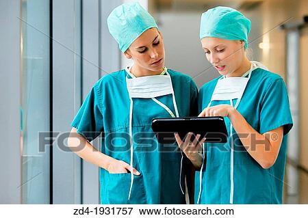 Surgeons with tablet in the operating room hallway, Onkologikoa Hospital, Oncology Institute, Case Center for prevention, diagnosis and treatment of cancer, Donostia, San Sebastian, Gipuzkoa, Basque Country, Spain View Large Photo Image Stock Photo - Surgeons with tablet in the operating room hallway, Onkologikoa Hospital, Oncology Institute, Case Center for prevention, diagnosis and treatment of cancer, Donostia, San Sebastian, Gipuzkoa, Basque Country, Spain. Fotosearch