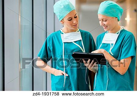 Surgeons with tablet in the operating room hallway, Onkologikoa Hospital, Oncology Institute, Case Center for prevention, diagnosis and treatment of cancer, Donostia, San Sebastian, Gipuzkoa, Basque Country, Spain View Large Photo Image Stock Photo - Surgeons with tablet in the operating room hallway, Onkologikoa Hospital, Oncology Institute, Case Center for prevention, diagnosis and treatment of cancer, Donostia, San Sebastian, Gipuzkoa, Basque Country, Spain. Fotosearch