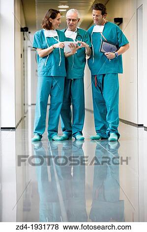 Surgeons with tablet in the operating room hallway, Onkologikoa Hospital, Oncology Institute, Case Center for prevention, diagnosis and treatment of cancer, Donostia, San Sebastian, Gipuzkoa, Basque Country, Spain View Large Photo Image Stock Photo - Surgeons with tablet in the operating room hallway, Onkologikoa Hospital, Oncology Institute, Case Center for prevention, diagnosis and treatment of cancer, Donostia, San Sebastian, Gipuzkoa, Basque Country, Spain. Fotosearch