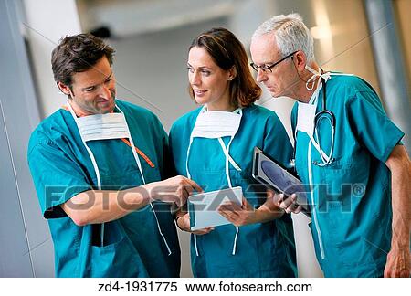 Surgeons with tablet in the operating room hallway, Onkologikoa Hospital, Oncology Institute, Case Center for prevention, diagnosis and treatment of cancer, Donostia, San Sebastian, Gipuzkoa, Basque Country, Spain View Large Photo Image Stock Photography - Surgeons with tablet in the operating room hallway, Onkologikoa Hospital, Oncology Institute, Case Center for prevention, diagnosis and treatment of cancer, Donostia, San Sebastian, Gipuzkoa, Basque Country, Spain. Fotosearch