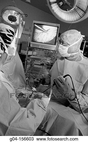 Stock Image - Surgeons working. Fotosearch