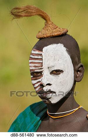 Stock Image - Surma tribe make-up. Near Kibish. Ethiopia.. Fotosearch