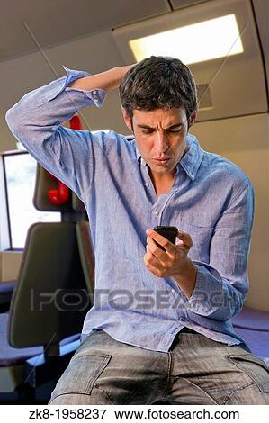 Surprised man shouting to phone mobile. View Large Photo Image Stock Photo - Surprised man shouting to phone mobile.. Fotosearch