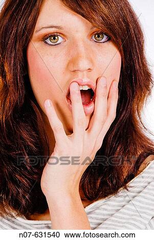 Stock Image - surprised young woman. Fotosearch