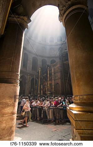 Stock Photo - surreal rays of light flood the Church of the Holy Sepulchre in Jerusalem. Fotosearch