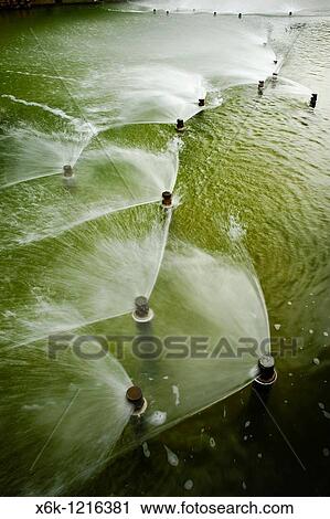 Stock Image - Surtidores de agua a presi? n, Parc de Diagonal Mar, Barcelona, Catalunya, Espaa. Fotosearch