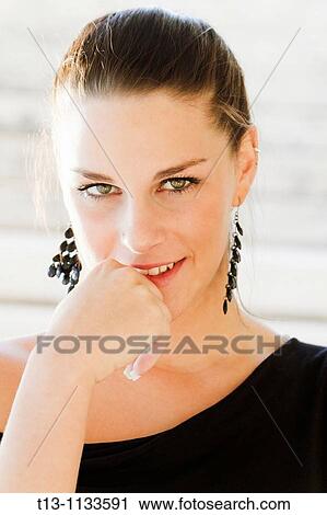 Suspicious young woman portrait View Large Photo Image Stock Image - Suspicious young woman portrait. Fotosearch