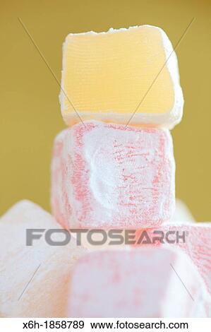 sweet tower of turkish delight - pink and yellow cubes View Large Photo Image Stock Photo - sweet tower of turkish delight - pink and yellow cubes. Fotosearch