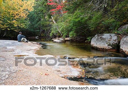 Swift River during the autumn months This river is located along the Kancamagus Highway route 112 which is one of New England's scenic byways Located in the White Mountains, New Hampshire USA View Large Photo Image Stock Photo - Swift River during the autumn months This river is located along the Kancamagus Highway route 112 which is one of New England's scenic byways Located in the White Mountains, New Hampshire USA. Fotosearch