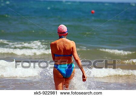 Swimmer woman in the Mediterranean sea (Spain) View Large Photo Image Stock Image - Swimmer woman in the Mediterranean sea (Spain). Fotosearch