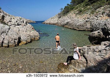 Stock Image - swimming at Cala creek Pedrosa Montgri massif Costa Brava, Catalonia, Spain, Europe. Fotosearch