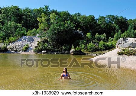 swimming in an ancient kaolin quarry on the commune of Echassieres, Allier department, Auvergne region, France, Europe View Large Photo Image Stock Photo - swimming in an ancient kaolin quarry on the commune of Echassieres, Allier department, Auvergne region, France, Europe. Fotosearch