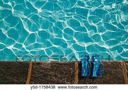 swimming pool in summer, no people, woman's sandals at poolside View Large Photo Image Stock Photo - swimming pool in summer, no people, woman's sandals at poolside. Fotosearch