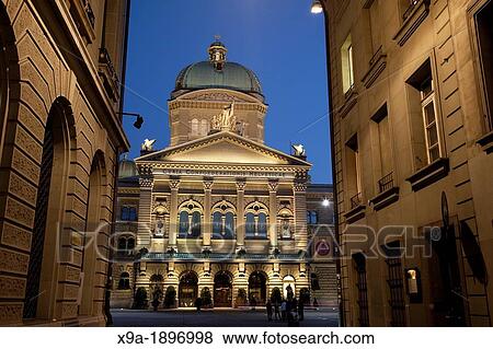 Stock Photo - Swiss Federal Assembly - Bundeshauser, Bundesplatz Square, Illuminated at Night Bern, Switzerland, Europe. Fotosearch