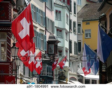 Stock Image - Switzerland, city of Zurich, 1st of august, national day in the old town, flags exhibition. Fotosearch