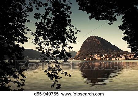 Switzerland, Ticino, Lake Lugano, Lugano, lakefront view of Monte San Salvador View Large Photo Image Stock Photography - Switzerland, Ticino, Lake Lugano, Lugano, lakefront view of Monte San Salvador. Fotosearch