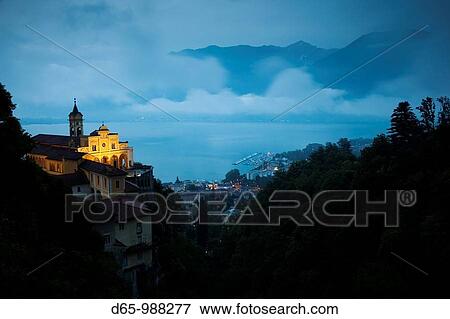 Stock Photo - Switzerland, Ticino, Lake Maggiore, Locarno, Madonna del Sasso church, evening. Fotosearch
