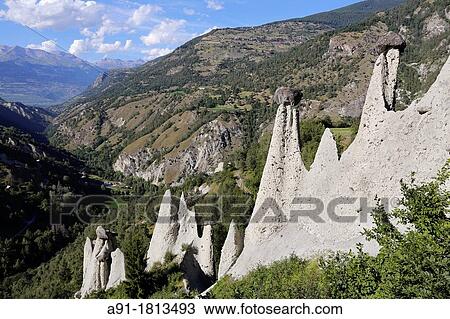 Switzerland, Valais, Val d? Herens, village of Euseigne, the natural pyramids View Large Photo Image Stock Image - Switzerland, Valais, Val d? Herens, village of Euseigne, the natural pyramids. Fotosearch