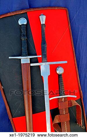 Stock Photo - swords and shield medieval, historical representation. Fotosearch