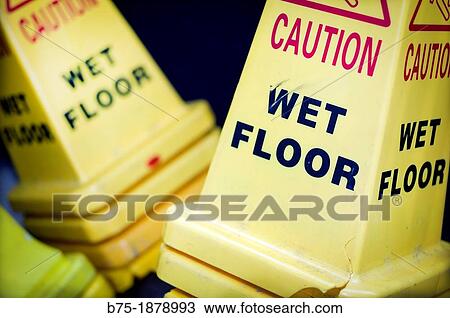 Stock Image - symbols of caution wet floor. Fotosearch