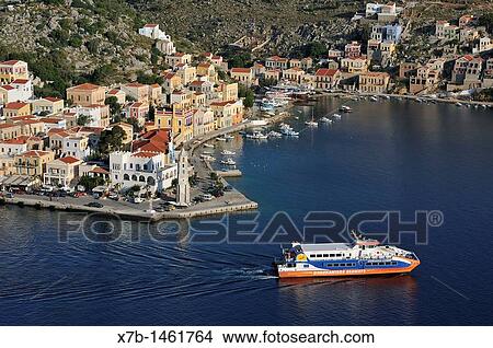 Symi Dodecanese Islands Greece Dodekanisos Seaways Ferry leaving Gialos Harbour View Large Photo Image Picture - Symi Dodecanese Islands Greece Dodekanisos Seaways Ferry leaving Gialos Harbour. Fotosearch