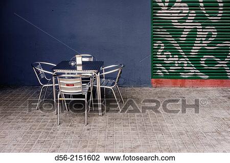 Table and chairs of a bar in the street, Valencia, Spain. View Large Photo Image Stock Image - Table and chairs of a bar in the street, Valencia, Spain.. Fotosearch