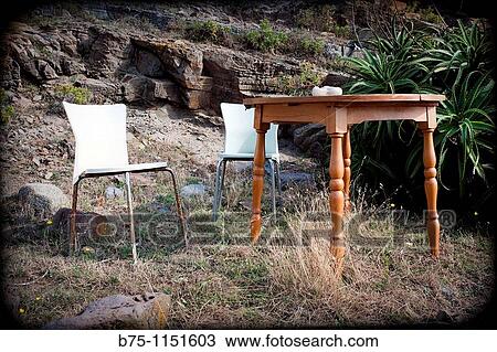Stock Image - Table and chairs. Fotosearch