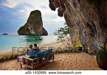 Tables from The Grotto Restaurant on the beach, Hotel Rayavadee, Hat Phra Nang, Krabi, Thailand. View Large Photo Image Stock Photography - Tables from The Grotto Restaurant on the beach, Hotel Rayavadee, Hat Phra Nang, Krabi, Thailand.. Fotosearch