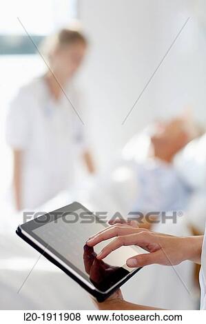 Tablet nurse in hospital room, Onkologikoa Hospital, Oncology Institute, Case Center for prevention, diagnosis and treatment of cancer, Donostia, San Sebastian, Gipuzkoa, Basque Country, Spain View Large Photo Image Stock Photo - Tablet nurse in hospital room, Onkologikoa Hospital, Oncology Institute, Case Center for prevention, diagnosis and treatment of cancer, Donostia, San Sebastian, Gipuzkoa, Basque Country, Spain. Fotosearch