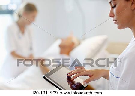 Tablet nurse in hospital room, Onkologikoa Hospital, Oncology Institute, Case Center for prevention, diagnosis and treatment of cancer, Donostia, San Sebastian, Gipuzkoa, Basque Country, Spain View Large Photo Image Stock Photo - Tablet nurse in hospital room, Onkologikoa Hospital, Oncology Institute, Case Center for prevention, diagnosis and treatment of cancer, Donostia, San Sebastian, Gipuzkoa, Basque Country, Spain. Fotosearch