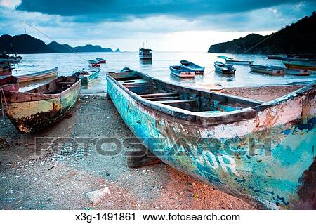 Taganga is a small fishing port on the Caribbean coast of Colombia. Tourism has become a major business in this small village View Large Photo Image Stock Image - Taganga is a small fishing port on the Caribbean coast of Colombia. Tourism has become a major business in this small village. Fotosearch