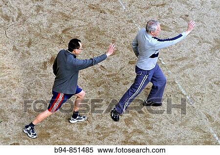 Tai-chi exercise. Barcelona, Catalonia, Spain View Large Photo Image Stock Photography - Tai-chi exercise. Barcelona, Catalonia, Spain. Fotosearch