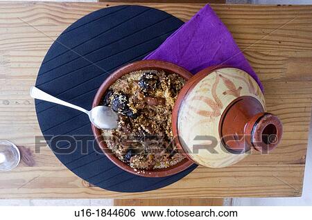 Tajin clay pot with a spoon View Large Photo Image Stock Photograph - Tajin clay pot with a spoon. Fotosearch