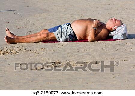 Taking a Sunbath on Patong Beach, Phuket, Thailand. View Large Photo Image Stock Photo - Taking a Sunbath on Patong Beach, Phuket, Thailand.. Fotosearch