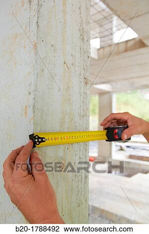 Taking measures in concrete beam, retractable tape, housing construction, Basque Country, Spain View Large Photo Image Stock Image - Taking measures in concrete beam, retractable tape, housing construction, Basque Country, Spain. Fotosearch