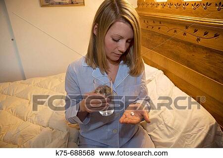 taking medicine at bedtime View Large Photo Image Stock Photo - taking medicine at bedtime. Fotosearch