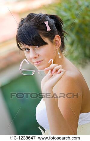 Taking off glasses View Large Photo Image Stock Photo - Taking off glasses. Fotosearch