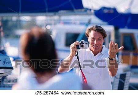 Picture - Taking photos at the marina. Fotosearch