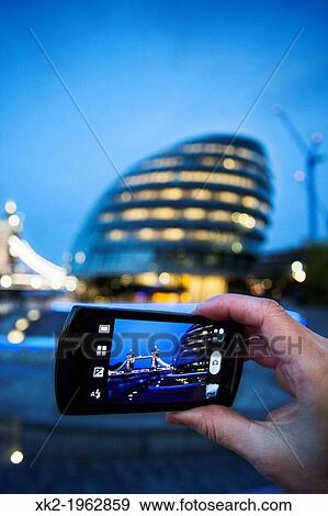 Taking photos of tower bridge with the City Hall at background, London, UK View Large Photo Image Stock Photo - Taking photos of tower bridge with the City Hall at background, London, UK. Fotosearch