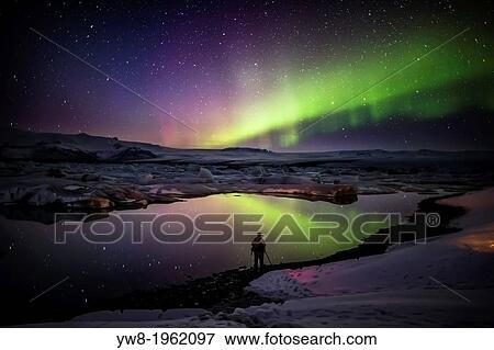 Taking pictures of the Aurora Borealis or Northern lights at the Jokulsarlon, Breidamerkurjokull, Vatnajokull Ice Cap, Iceland. View Large Photo Image Stock Photo - Taking pictures of the Aurora Borealis or Northern lights at the Jokulsarlon, Breidamerkurjokull, Vatnajokull Ice Cap, Iceland.. Fotosearch