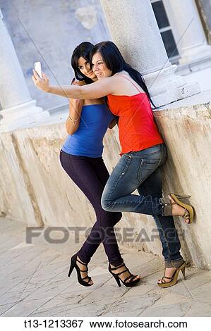 Taking self pictures two girlfriends View Large Photo Image Stock Photo - Taking self pictures two girlfriends. Fotosearch